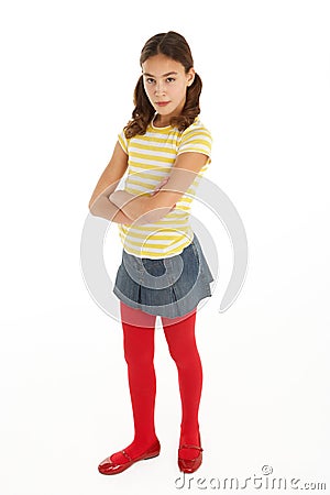 Studio Portrait Of Defiant Young Girl Stock Photo