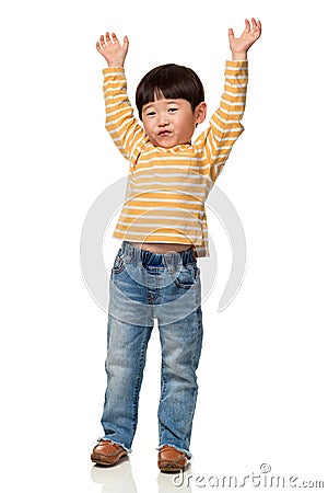 Studio portrait of an East Asian male child with both hands open Stock Photo