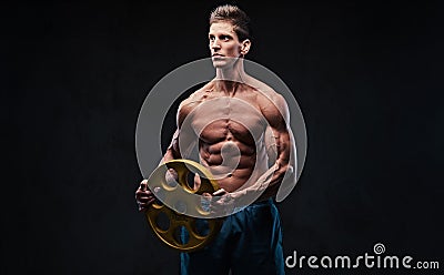 Ectomorph shirtless athletic male holds barbell weight. Stock Photo