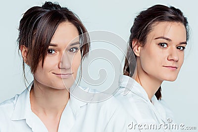 Studio portrait of female twins Stock Photo