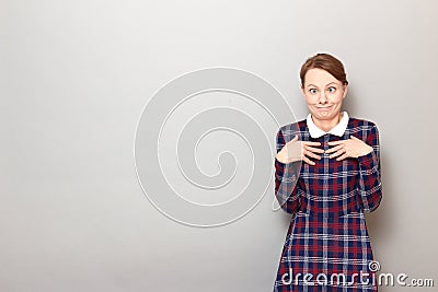 Portrait of funny confused perplexed girl making silly goofy faces Stock Photo