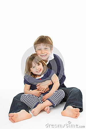 Studio Portrait Of Happy Brother And Sister Stock Photo