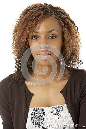 Studio Portrait Of Happy Teenage Girl Stock Photo