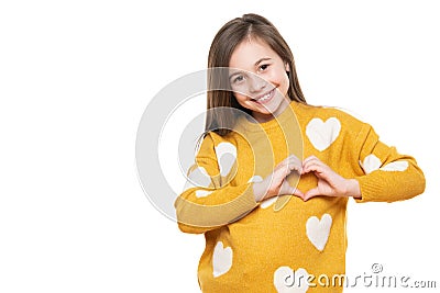 Studio portrait of a little girl on white background making a heart gesture with her hands. Fostering a child. Stock Photo