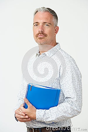 Studio Portrait Of Male Pre School Teacher Stock Photo