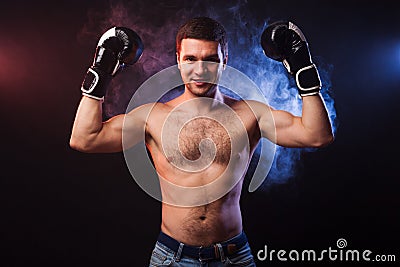 Studio portrait of a muscular boxer in professional gloves of Eu Stock Photo