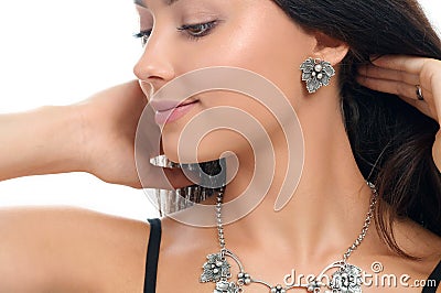 Studio portrait pretty young woman with collection stylish jewel Stock Photo