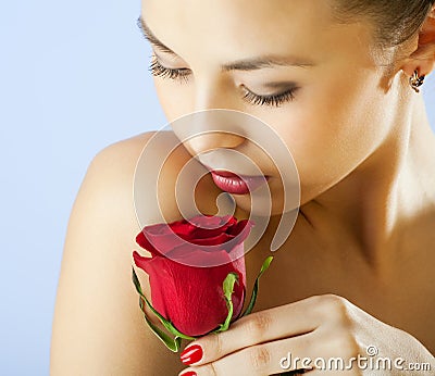 Studio portrait of sensual woman with rose Stock Photo