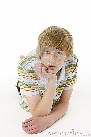 Studio Portrait Of Serious Teenage Boy Stock Photo