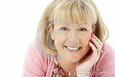 Studio Portrait of Smiling Mother Stock Photo