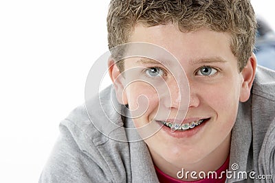 Studio Portrait of Smiling Teenage Boy Stock Photo