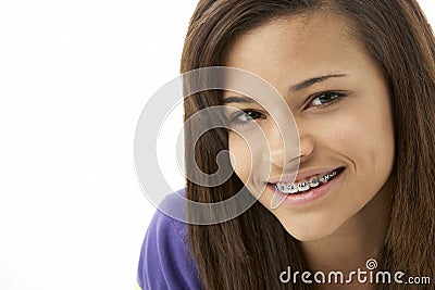 Studio Portrait of Smiling Teenage Girl Stock Photo