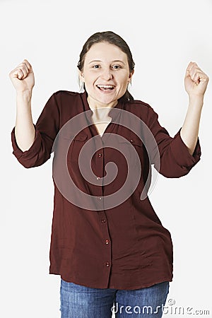 Studio Portrait Of Woman With Jubilant Expression Stock Photo