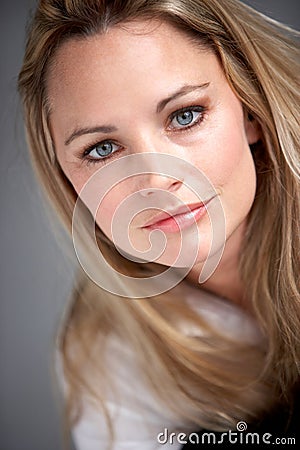 Studio Portrait Of Woman Wearing White Shirt Stock Photo