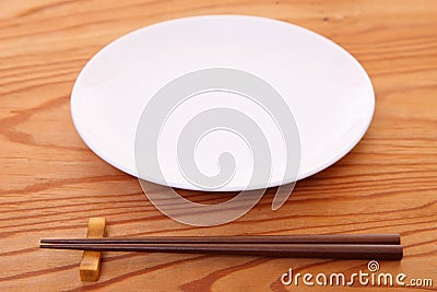 Empty Japanese dish with chopsticks Stock Photo