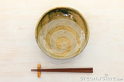 Empty Japanese dish with chopsticks Stock Photo