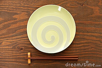 Empty Japanese dish with chopsticks Stock Photo