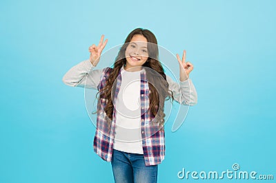 Studio shot of glad child. childhood happiness. Pleasant emotions. stylish teen girl turquoise background. pretty teen Stock Photo