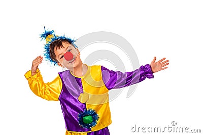 Studio shot of a little boy wearing carnival costume of a clown with a red round nose, isolate. He gesticulates with his hands Stock Photo