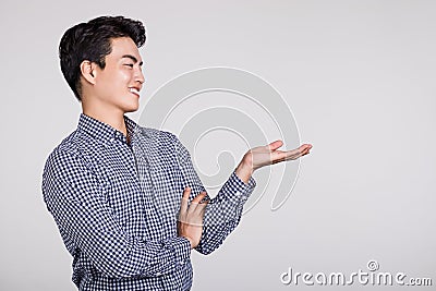 Studio shot of a man`s hand pointing at something Stock Photo