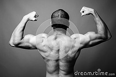 Muscular Indian man with mustache shirtless against gray background Stock Photo