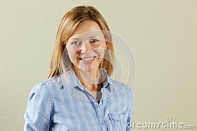 Studio Shot Of Relaxed Middle Aged Woman Stock Photo