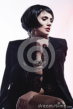Fashion Woman in Black Guipure Dress. Professional Makeup Stock Photo