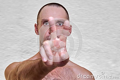 A sporty man with a naked torso trains in the studio Stock Photo