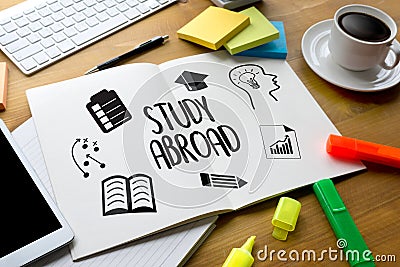 STUDY ABROAD Thoughtful male person looking to the digital table Stock Photo