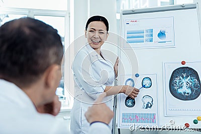 Positive woman presenting her neurology research Stock Photo