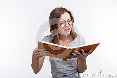 Study, education, people concept - female student is tired of learning classes, she is in gray shirt, standing with Stock Photo