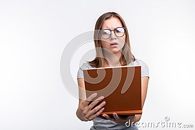 Study, education, people concept - female student is tired of learning classes, she is in gray shirt, standing with Stock Photo