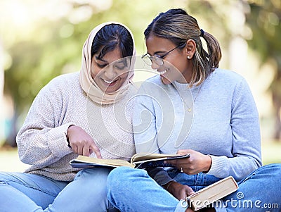 Study friends, park reading and outdoor woman students with university textbook and books. College female, girl friend Stock Photo