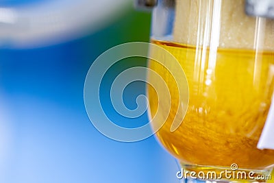 Separating by filtration and evaporation condensation the component substances from liquid mixture in Lab. Stock Photo