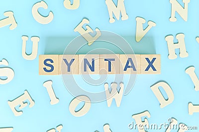 Study syntax in linguistics concept. Wooden blocks word typography flat lay in blue background. Stock Photo