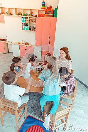 Top view of happy nice kids during the lesson Stock Photo