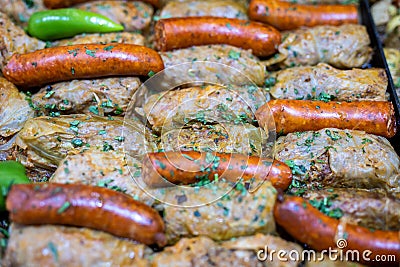 Stuffed cabbage with sausages at market Stock Photo