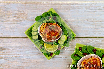 Stuffed clams with crabmeat and bread crumbs with salad and lemon. Seafood concept Stock Photo