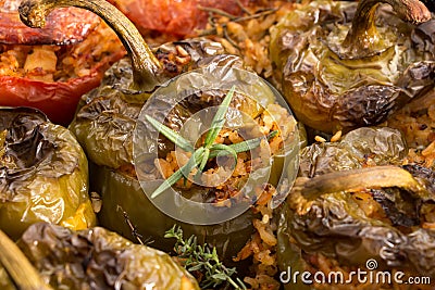 Stuffed green bell peepers in dish, closeup. Stock Photo