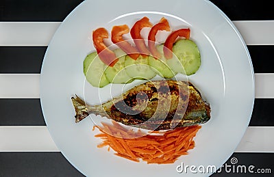 Stuffed mackeral with a salad side Stock Photo