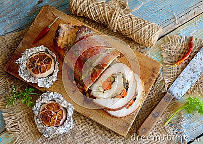 Stuffed Pork Loin Roast with baked garlic Stock Photo