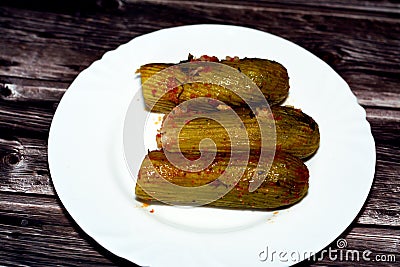 Stuffed squash, courgette, marrow, mahshi, or zucchini filled with white rice, onion, parsley, dill and coriander Stock Photo