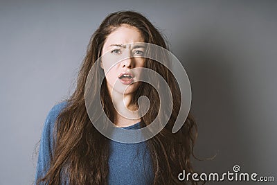 Stunned young woman is taken aback Stock Photo