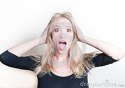 Stunned young woman on white portrait Stock Photo