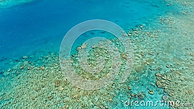 Stunning aerial drone image of a great coral reef marine channel in calm weather flat water and incredible colorful sea ocean bed Stock Photo