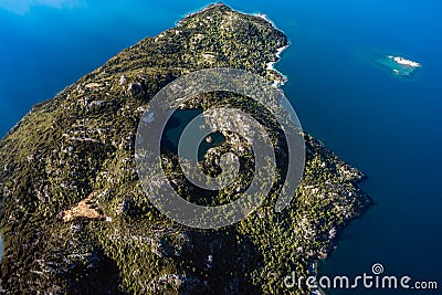 Stunning aerial image of the Arethusa Pool within Mou Waho island on Lake Wanaka taken on a sunny winter day, New Zealand Stock Photo