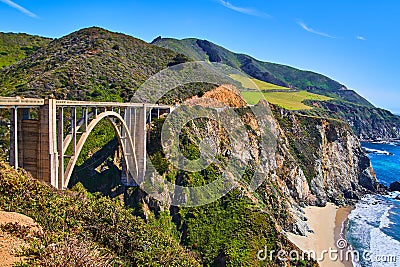 Stunning arched Bixby Bridge on west coast with beaches, mountains, and ocean Stock Photo