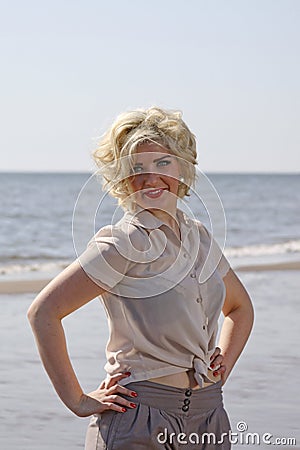 Stunning blonde haired teenage girl at the beach Stock Photo