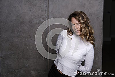 Stunning blonde in white sweater Stock Photo