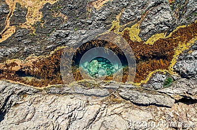 Stunning close up aerial drone view of a rock pool at the Mermaid Rock Pools at Matapouri Bay near Whangarei on the North Island Stock Photo